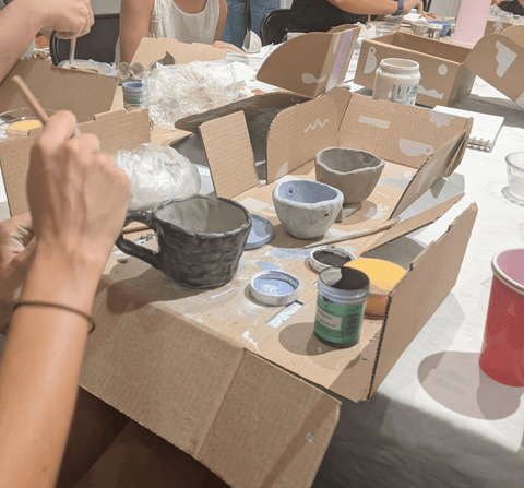 Mug and hanging planter made at pottery workshop